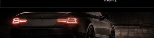 Black performance car at night